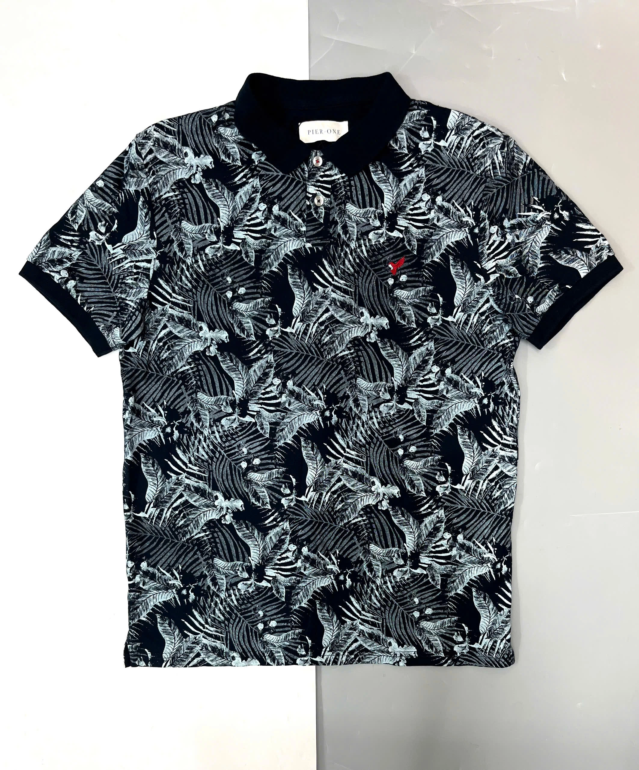 ÁO POLO XANH SẪM HOẠ TIẾT LÁ CỌ